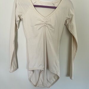 ARQ cream long sleeve leotard size small